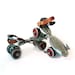 Red and silver Hustler Speed King roller skates