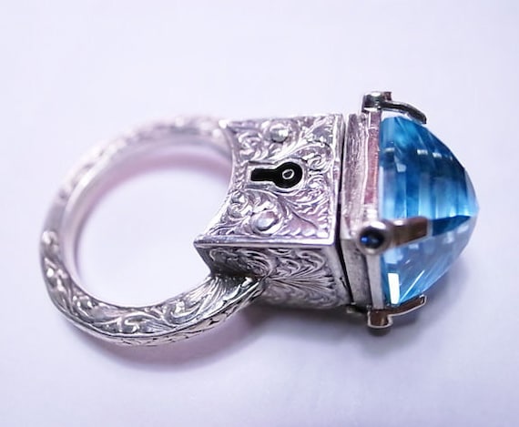 Locking Poison Ring with Key on Chain in Sterling Silver with Topaz and Sapphires