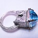 Locking Poison Ring with Key on Chain in Sterling Silver with Topaz and Sapphires