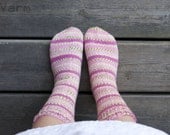 Hand knitted socks in pink and green stripes. Roses.