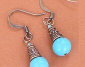 Turquoise globes with copper cones