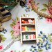 The Beach House Bookshelf Necklace by Coryographies