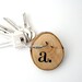 Choose your initial...Keychain made with wood and cable steel wire with your monogramme hand painted..