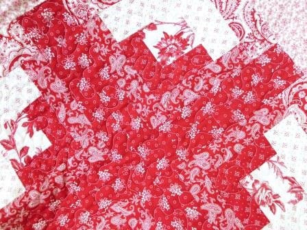 Red and white log cabin quilt