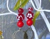 Red glass earrings are made w/ red glass beads, red glass beads w/ white flowers and swirls earrings