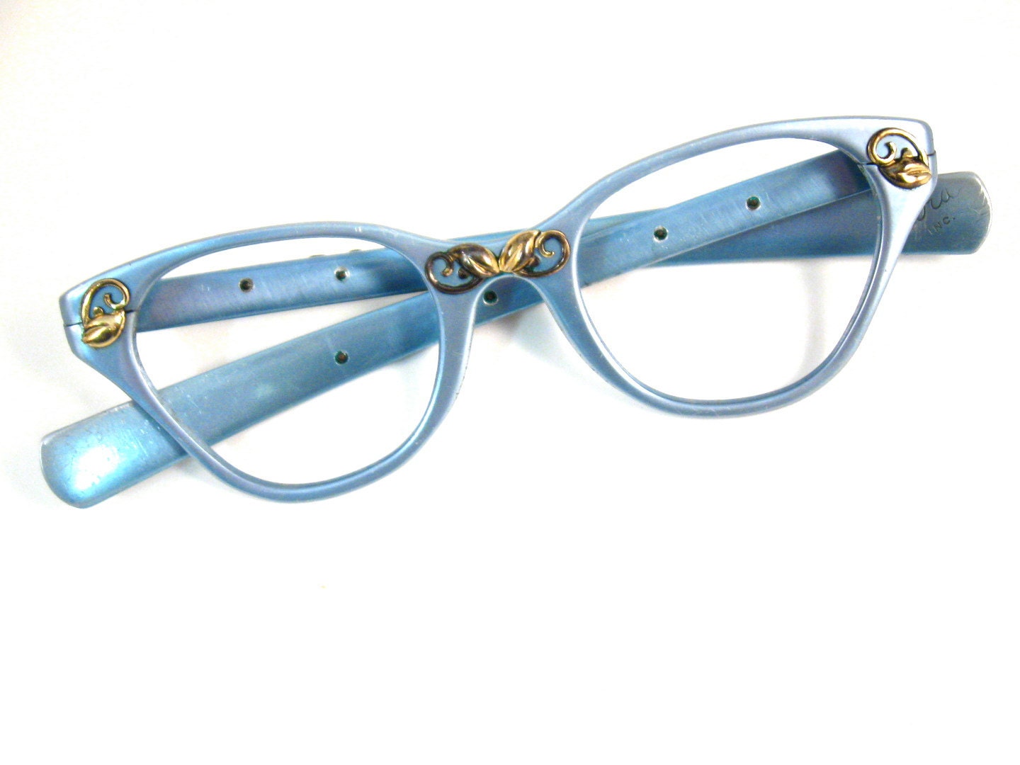 TURA sky blue cat eye glasses. gold embellishments. ornate. 1950s retro eyewear. aluminum and gold. no lenses. (VFAC)