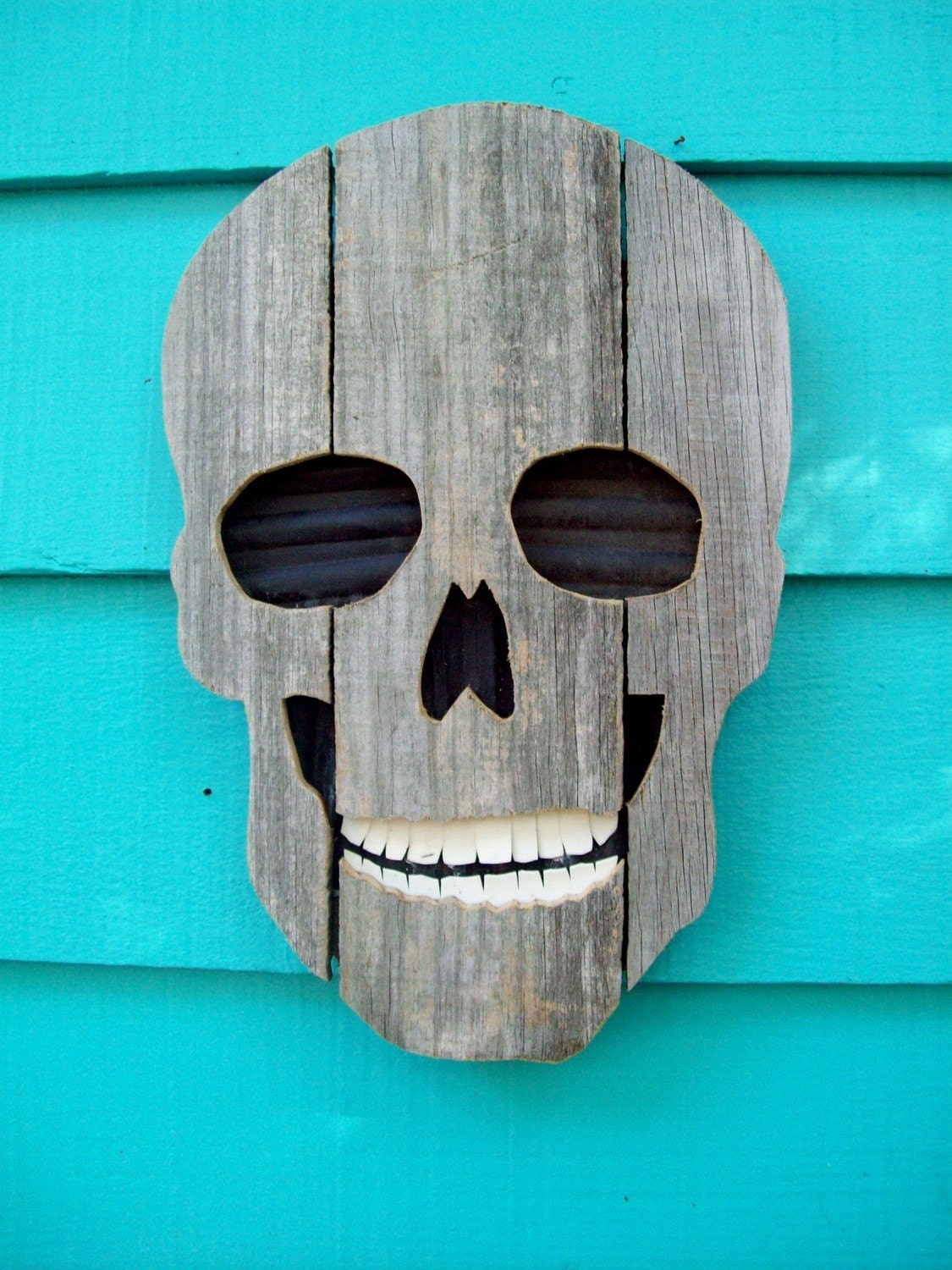 Skull made of recycled wood and plastic, upcycled fence wood