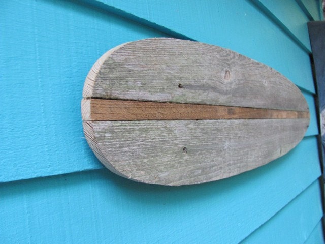Surfboard made of recycled fence wood.  longboard, surf, outdoor art