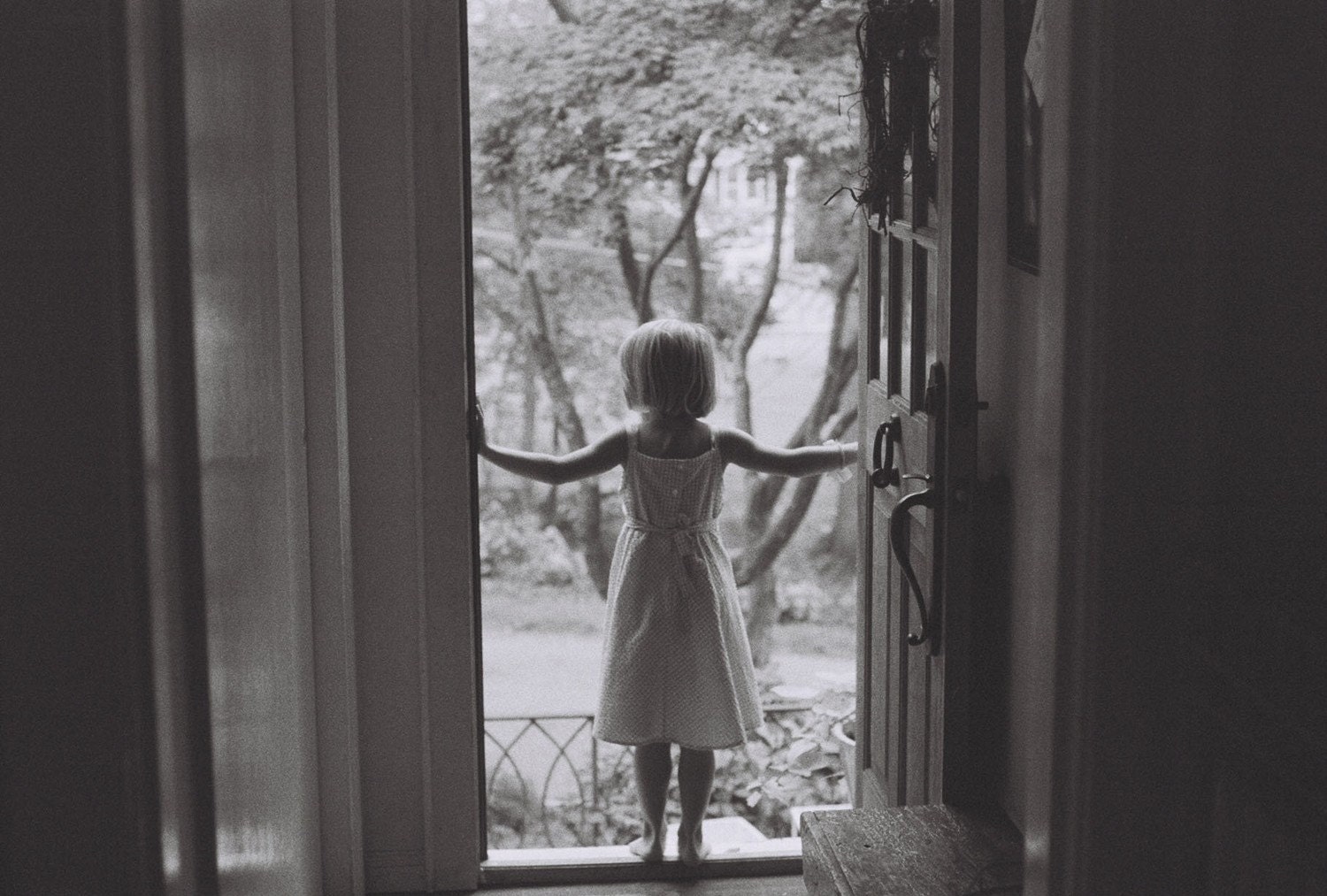 standing in the doorway, looking out