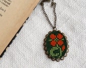 Cross stitch necklace Flower on dark green felt