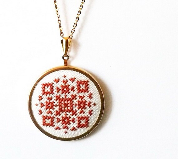 Hand embroidered jewelry amber geometrical ornament on white