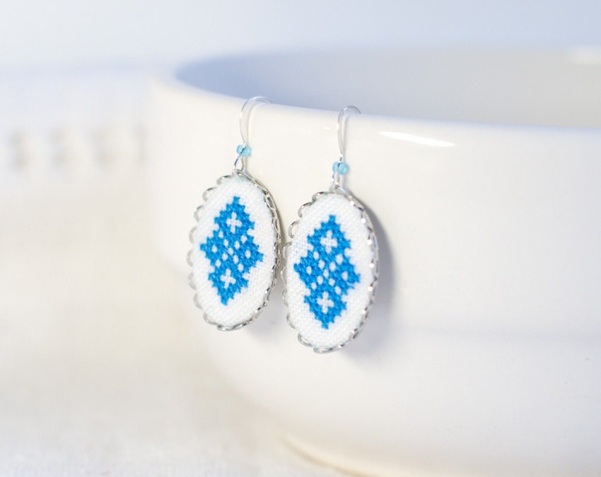 Hand embroidered earrings with blue Ukrainian cross stitch ornament with surgical steel ear wires