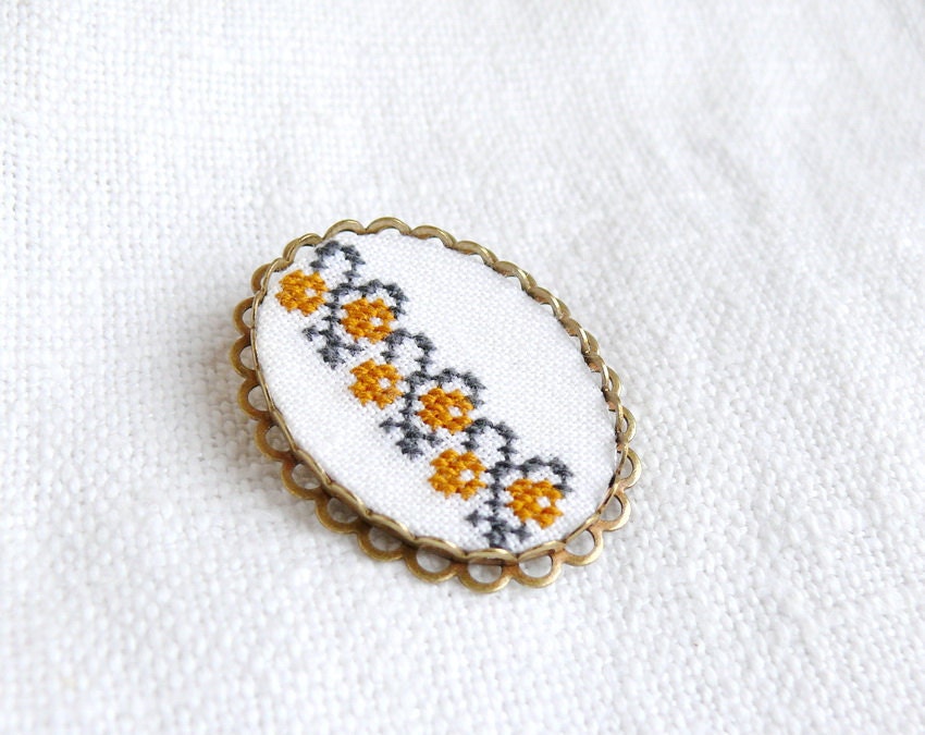 Hand embroidered brooch Ukrainian ornament on white - fall fashion