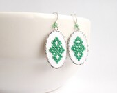 Green textile earrings with Ukrainian cross stitch ornament with surgical steel ear wires