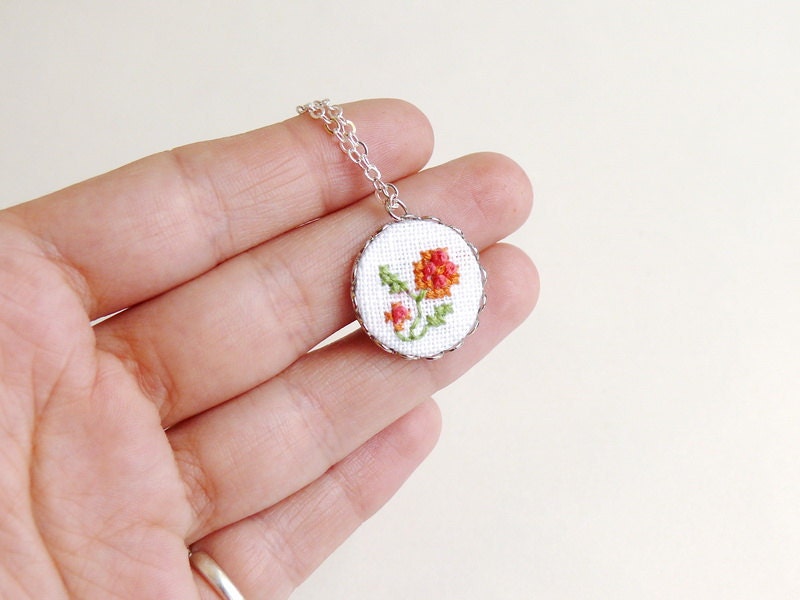 Tiny embroidered floral necklace with silver toned findings