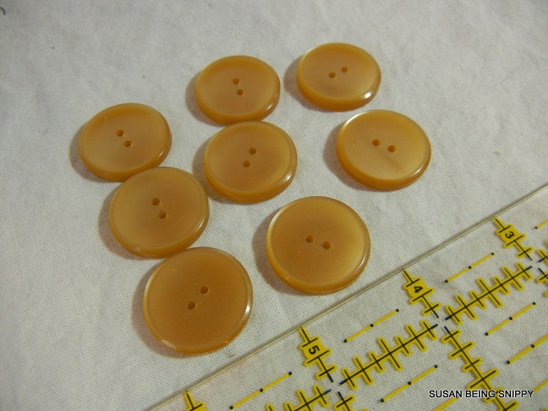 Buttons 8 creamy golden two hole plastic