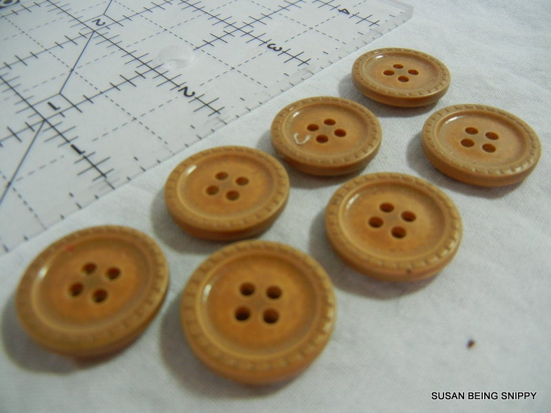Buttons  7 goldy brown ceramic 4 hole coat buttons