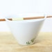 Hand Painted Ceramic Noodle Bowl With chopsticks green bamboo leaves botanical design modern minimalist white kitchen decor serving dish