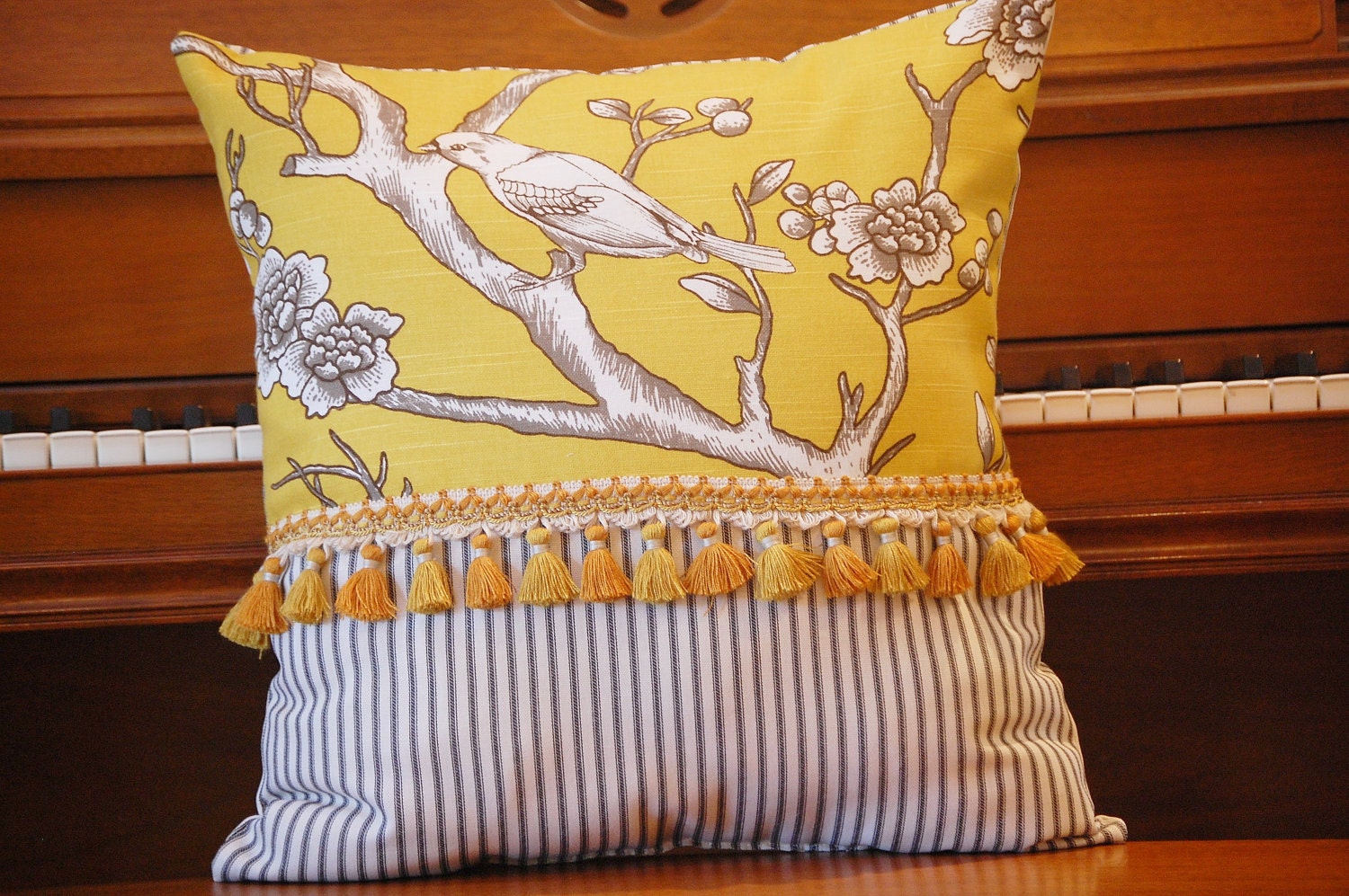 Yellow on black bird on a branch pillow collection
