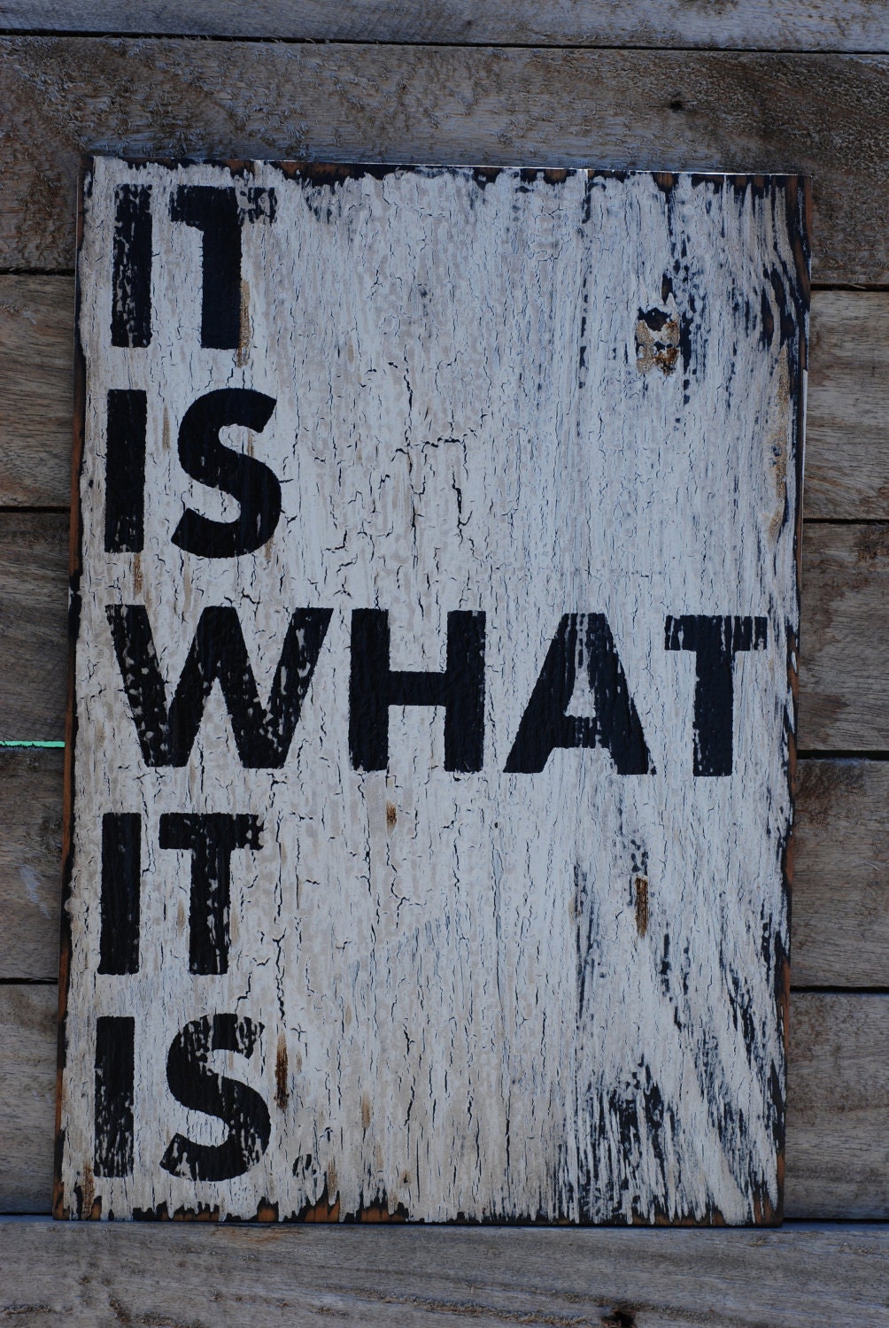 It is what it is sign made from reclaimed plywood