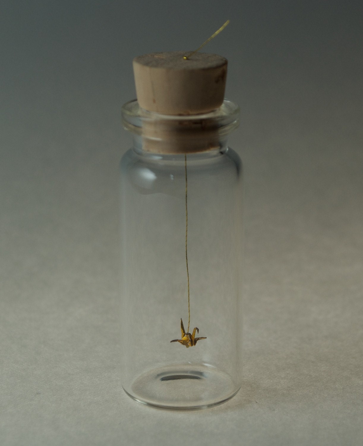 tiny origami golden crane