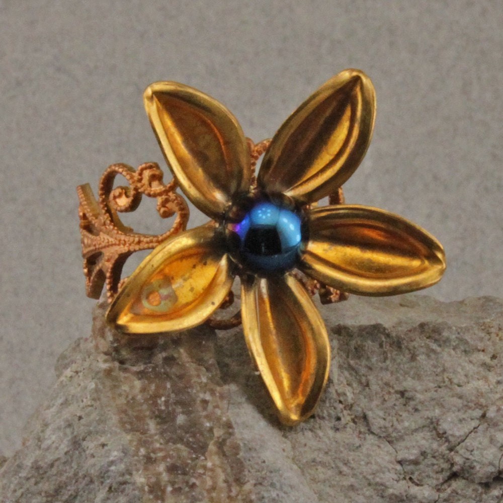 Blue Glass Cabochon and Flower Ring copper colored brass adjustable shank.
