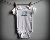 hand-printed linocut lily of the valley  baby onesie
