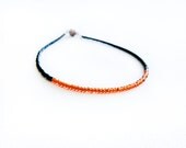 Africa thin seed beads anklet. Black burnt orange beaded tribal minimalist ankle bracelet, color blocking autumn fashion jewelry