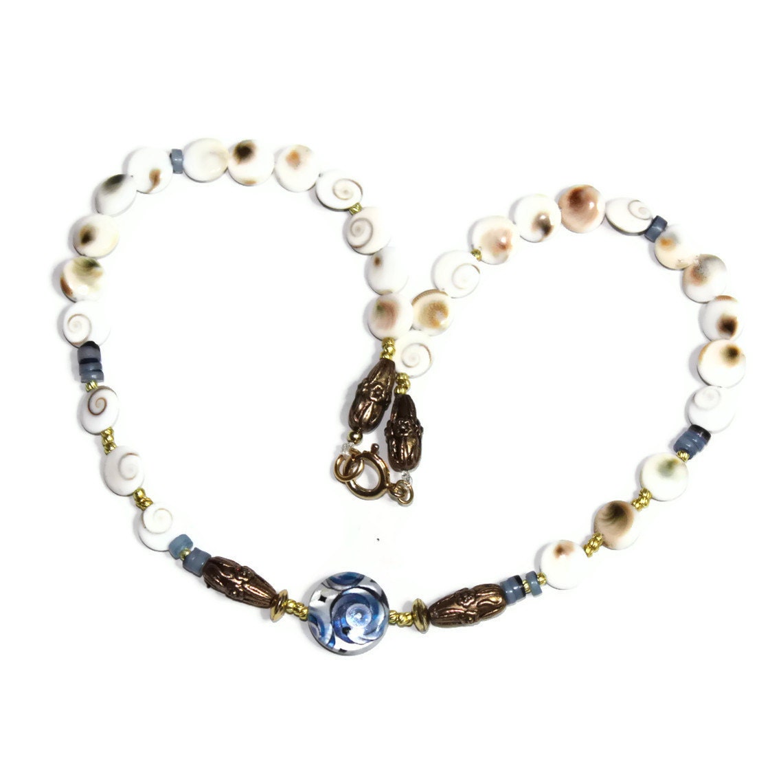 HOLDING for L's hubby - beaded necklace-decorative blue flat round shell- white brown Shiva eye disc- dark blue hammer shell Heische