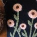 Felted Yellow Orange Flowers on Black Wool Pillow