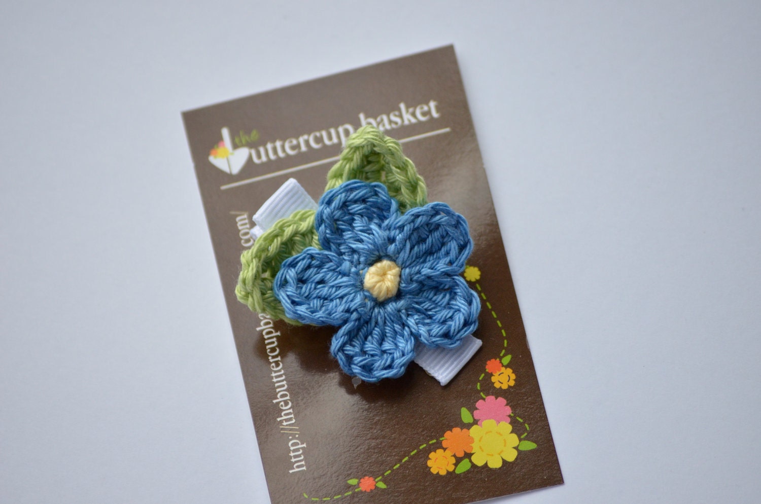 Crochet Flower Clip, "Forget Me Not", azure blue flower with ginger green leaves