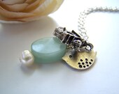 the birdhouse necklace.