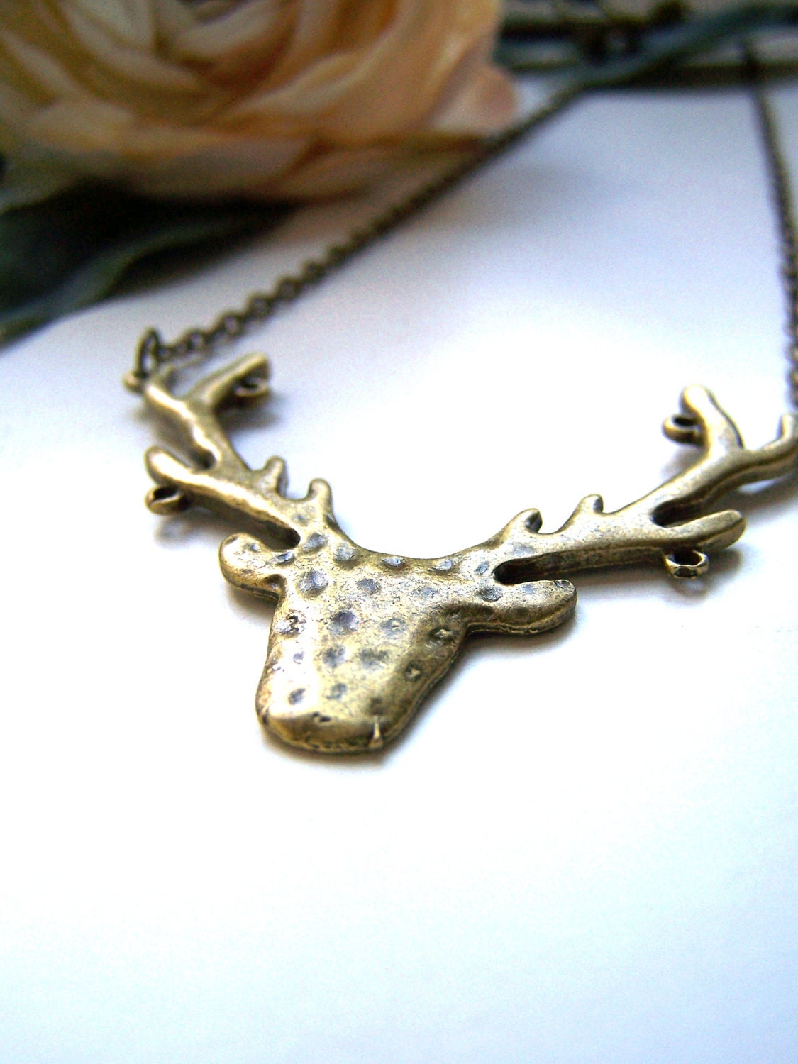 the bronze stag necklace.