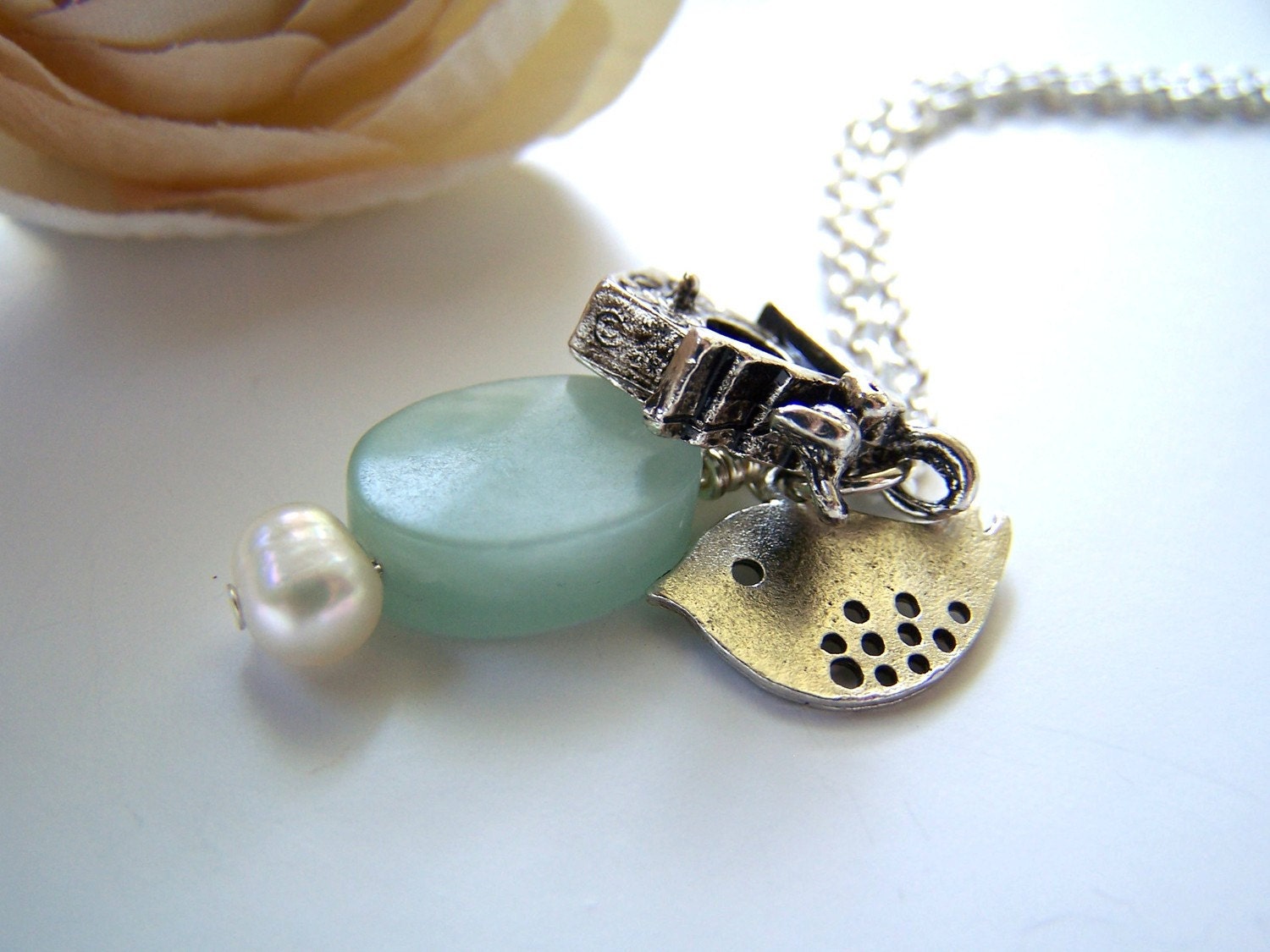 the birdhouse necklace.