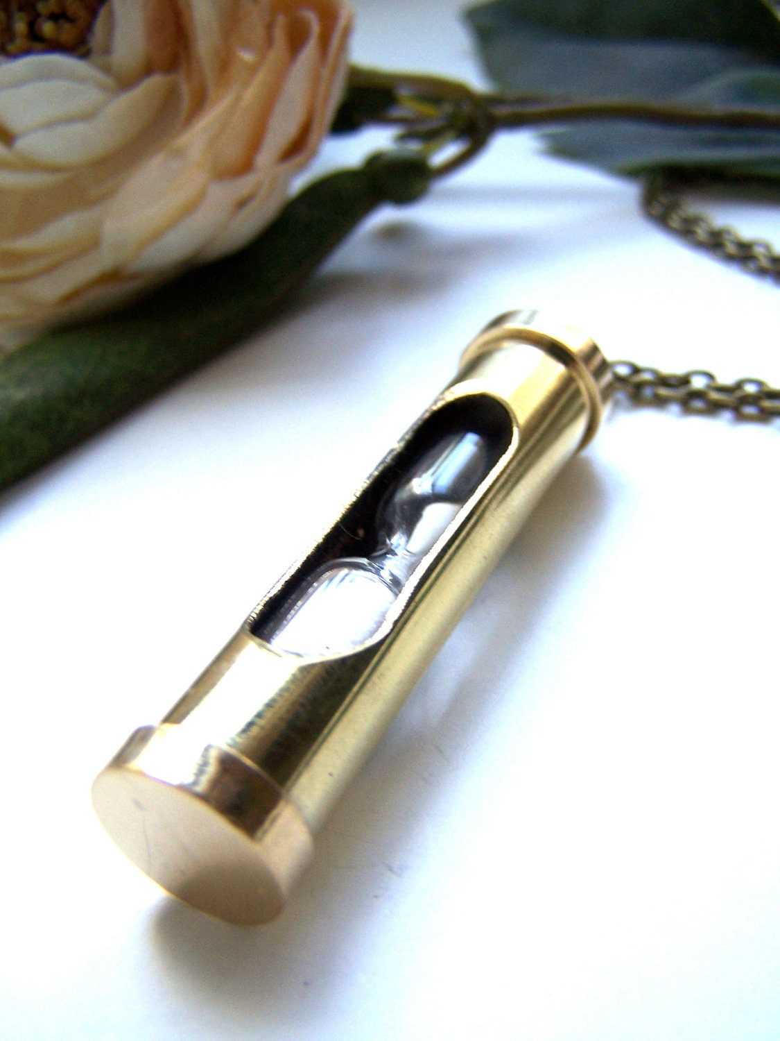 the hourglass necklace.