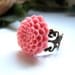 the pink floral ring.