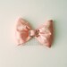 Silk Dupioni and Crystal Buckle bow on a clear comb, 5" x 3.5", your choice of color.