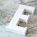 large E sign letter