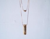 Drie - vintage brass geometric tube and brass bead double necklace