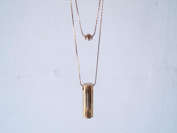 Drie - vintage brass geometric tube and brass bead double necklace
