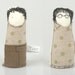 Boy and girl - little twins, she wearing glasses and a dress and he green polka-dot shirt and corduroy