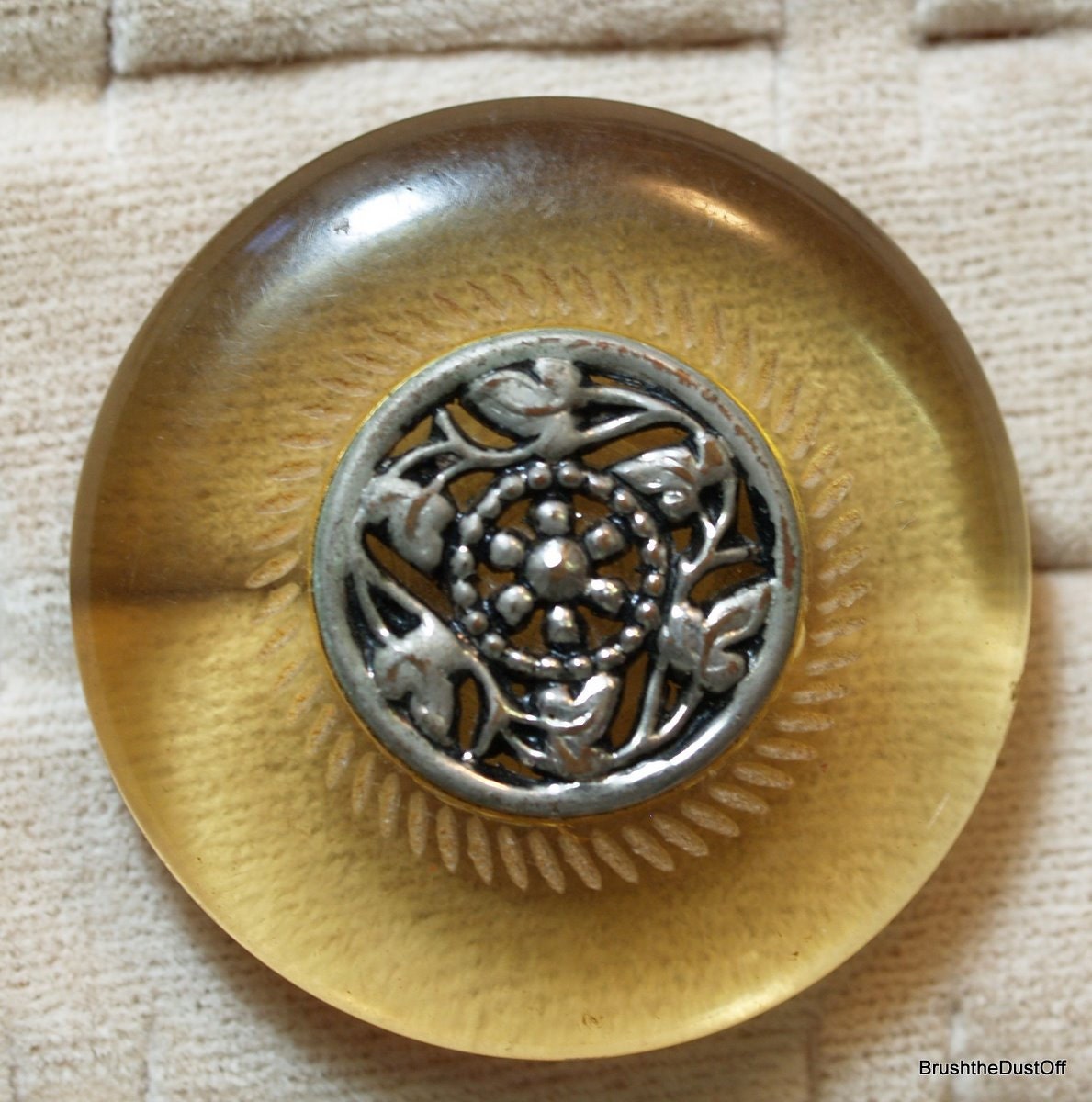 Large vintage Bakelite or catalin applejuice  button with silver decorative attached center
