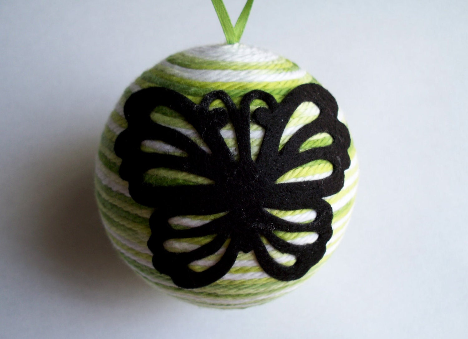 Butterfly felt design on Spring Green Yarn Ornament