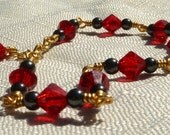 Sale 30% Off Hematite and red Swarovski crystal bracelet wire wrapped with gold dipped wire, reused beads, 7 1/4" to 8" long, free shipping