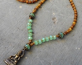 108 bead aromatic sandalwood and green crystal Buddha pendant necklace