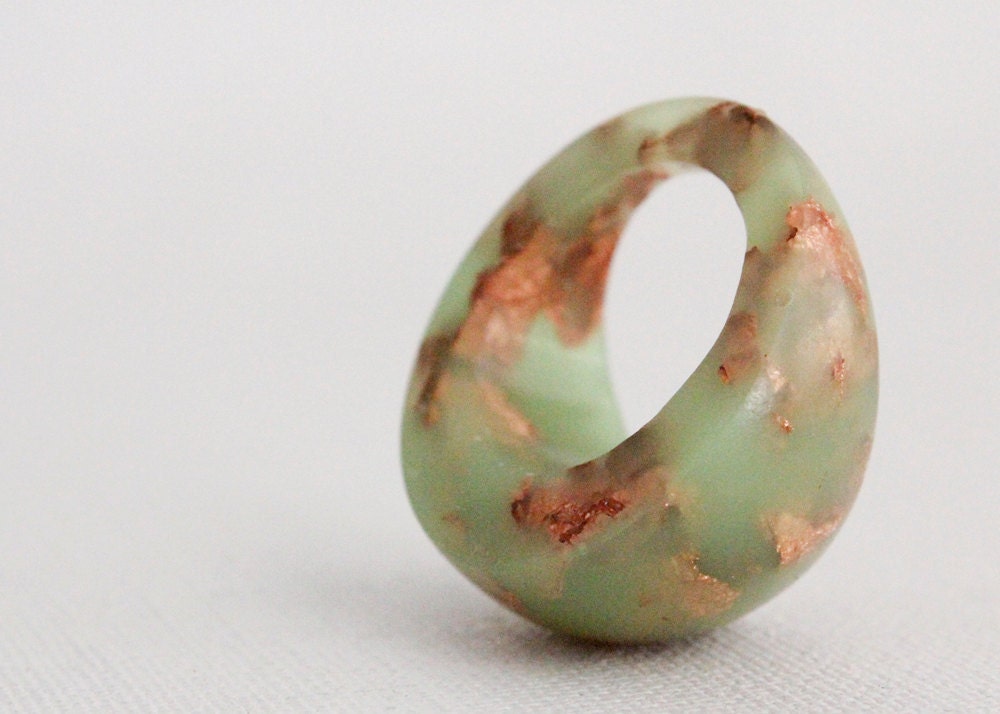 neon green dome ring with suspended copper flakes eco resin