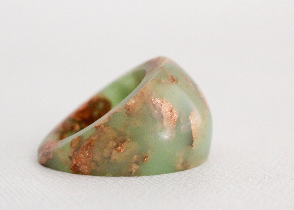 neon green dome ring with suspended copper flakes eco resin