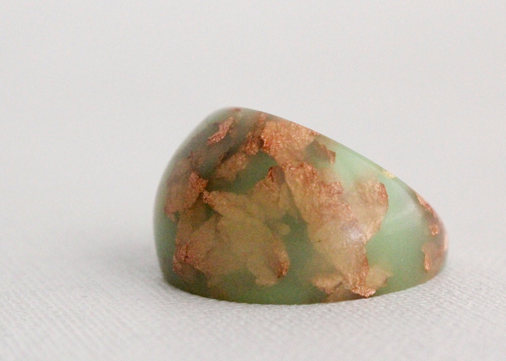 neon green dome ring with suspended copper flakes eco resin