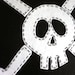 Black Skull and Crossbone cushion cover in small.