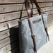 Waxed canvas bag/ carry all with leather handles and double buckle closure with straps COLLECTION UNISEX